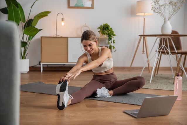 Person stretching on a yoga mat